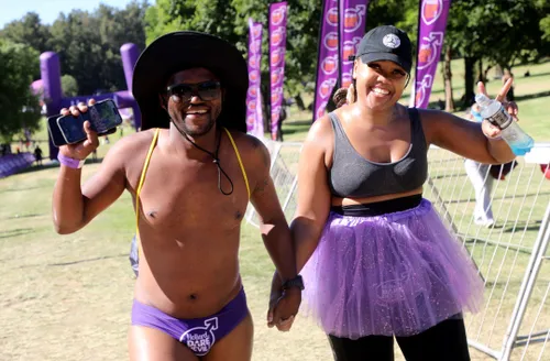 Men take to the streets in purple speedos for a worthy health cause