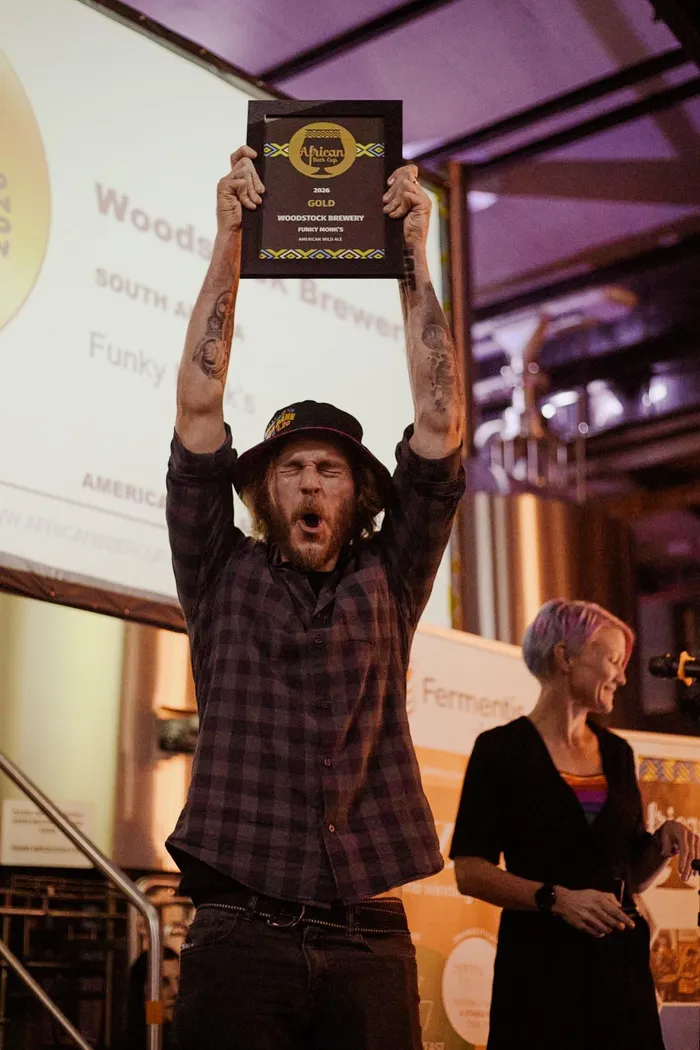 Tinus Lottering celebrates one of three gold medals at the 2026 African Beer Cup.