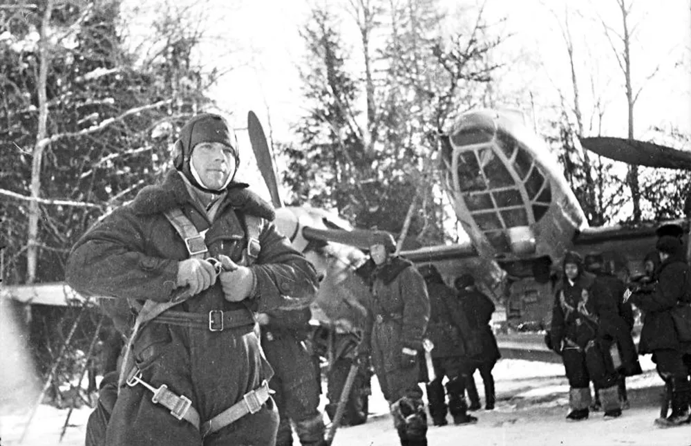 Crew of Soviet Petlyakov Pe-2 bomber getting ready for combat mission, 15 January 1942