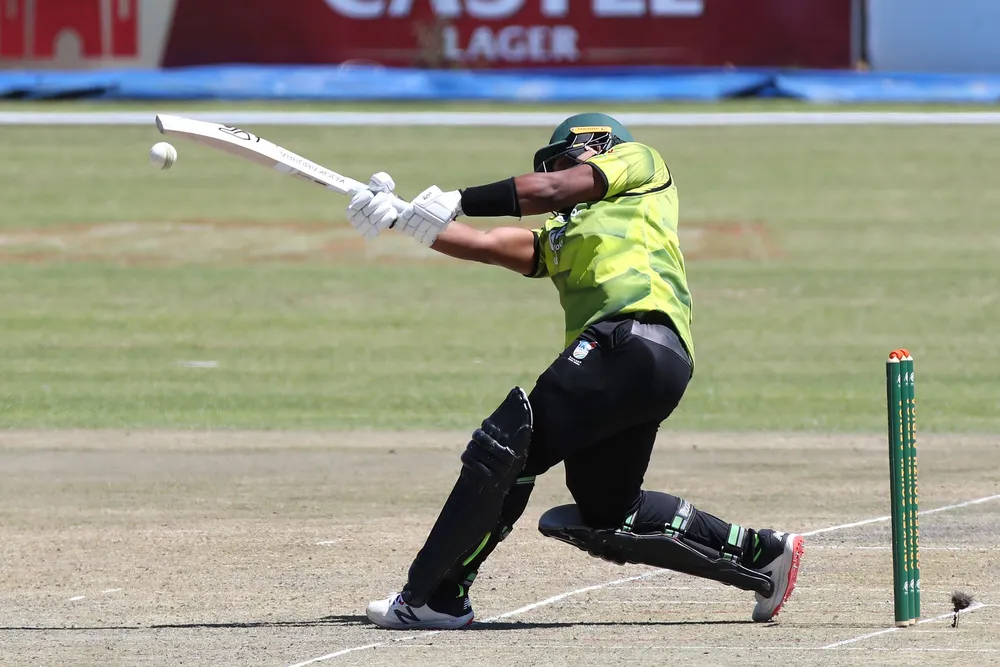 Sinethemba Qeshile of the Warriors attacks a delivery during the 2021/22 CSA Provincial T20 Cup cricket match against the Limpopo Impalas