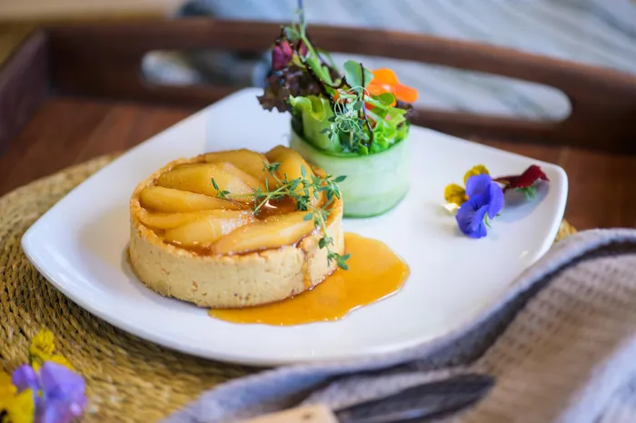 This gooey brie and caramelised pear tart is the perfect start to the meal.