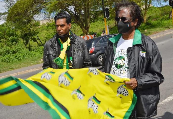 Former ward 71 councillor Pravin Vedan and ANC member Logie Naidoo, holding an ANC flag during an election campaign in Shallcross in 2021. 
