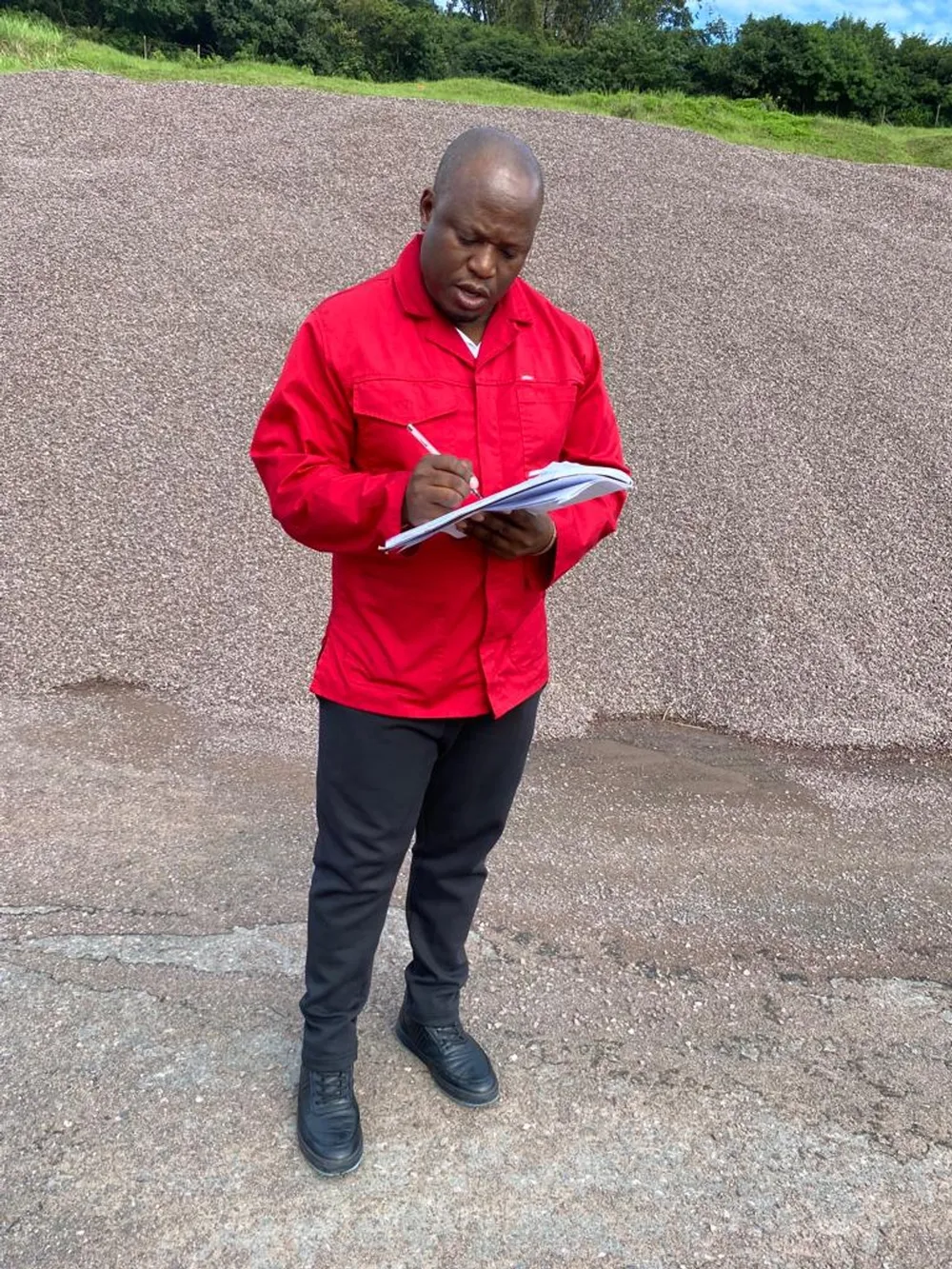 EThekwini MPAC chairperson Thami Xuma is shown with pen and paper in hand, inspecting the city’s abandoned tar plant