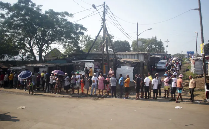 Voters queue to cast their ballots at KwaMashu Hostel, Durban. Technical, logistical, and administrative glitches led to long delays at voting stations, causing frustration and anger, says the writer. Picture: Khaya Ngwenya / Independent Newspapers