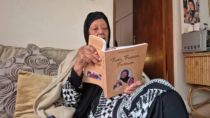 Abdeyah da Costa with her book Faith, Fashion, Fortitude