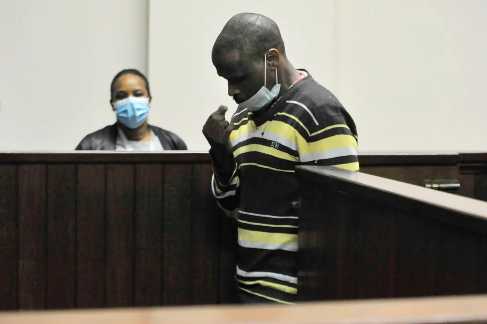 A man in the dock in court.