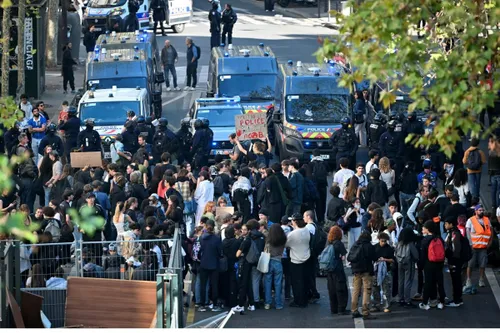 France teen protester loses hand picking up police grenade
