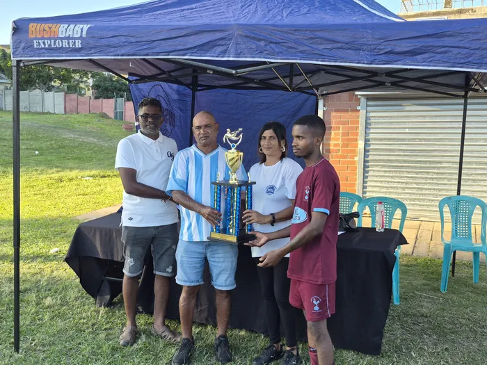 From left: Chatsworth Football Association Executive Member Hanban Veramuthu, Arena Spurs Chairman Morgan Govender, CFA Vice Chairperson Reishnee Munilall, and Arena Spurs player Themba Nomjana 