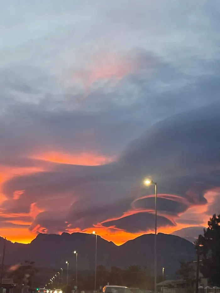 Rare cloud formations and radiant sunrise hues were on display in the early morning skies above Strand, Western Cape.