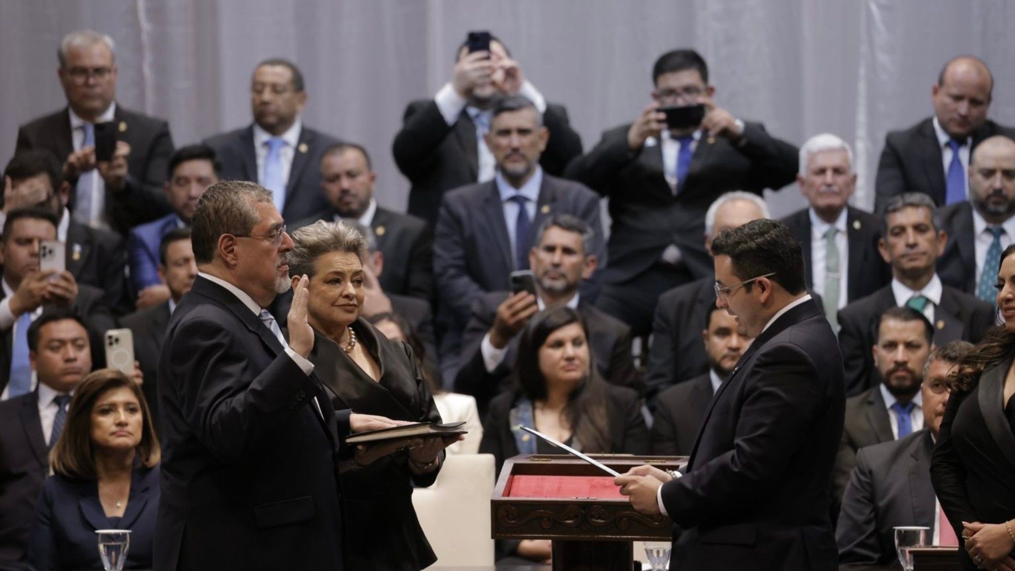 Guatemala president sworn in after coup threat, nine-hour delay