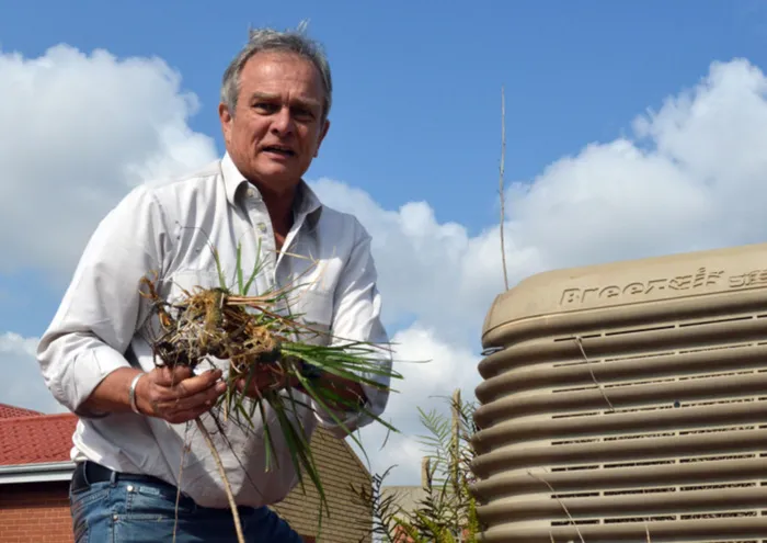 Post Office CEO Mark Barnes gets his hands dirty at the Alex post office eralier in 2016. Picture: Supplied.
