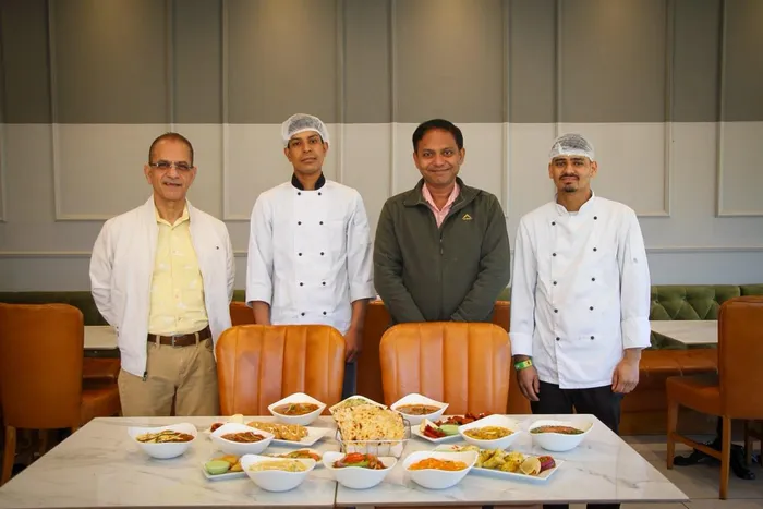Arvind Dhar is pictured with the 91 Haute Indian Restaurant general manager and chefs.