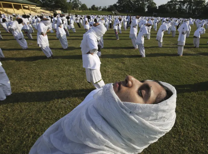 Kashmiri school students perform Yoga exercises on the occasion of the first International Day of Yoga in Srinagar, Kashmir, India. Picture: EPA/Farooq Khan