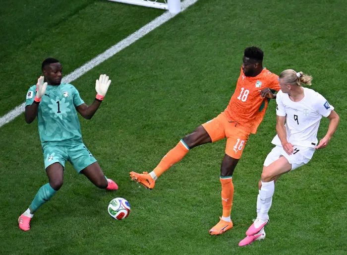 Ibrahim Sangare, centre, of Ivory Coast during the Round of 32 match of the 2026 FIFA World Cup, competes with Erling Haaland who scored Norway's second goal in their 2-1 win at Dallas Stadium in Dallas on Tuesday.