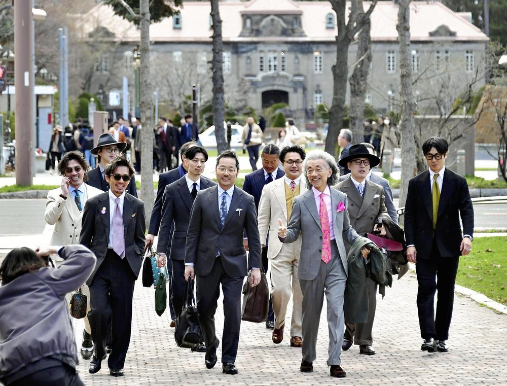 Men join ‘suit walks' to show elegance of attire