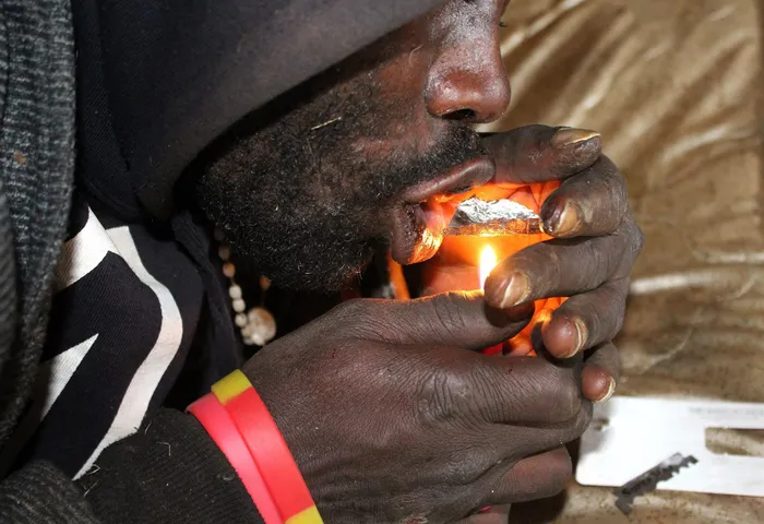 Awilo Shanku a nyaope addict smoking nyaope under Madela drive bridge.Image:Nicolite Ngwenyama