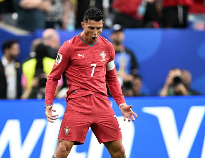 Cristiano Ronaldo of Portugal celebrates scoring against Uzbekistan.
