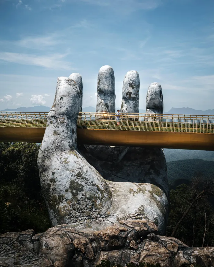 Explore the Golden Bridge in Bà Nà Hills resort near Da Nang, Vietnam.