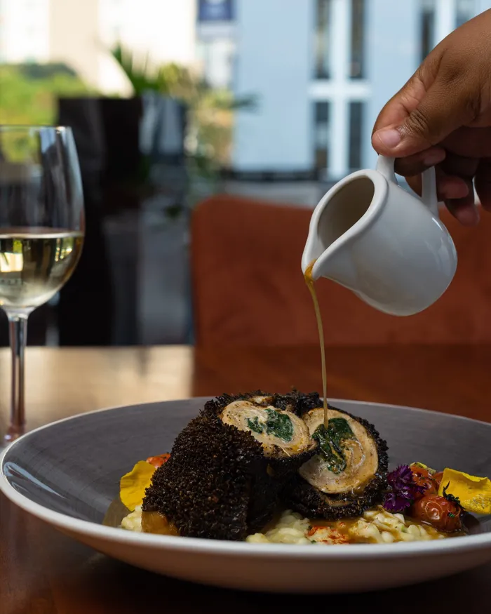 Chef Gugu Wanda’s chicken and tripe roulade on African risotto