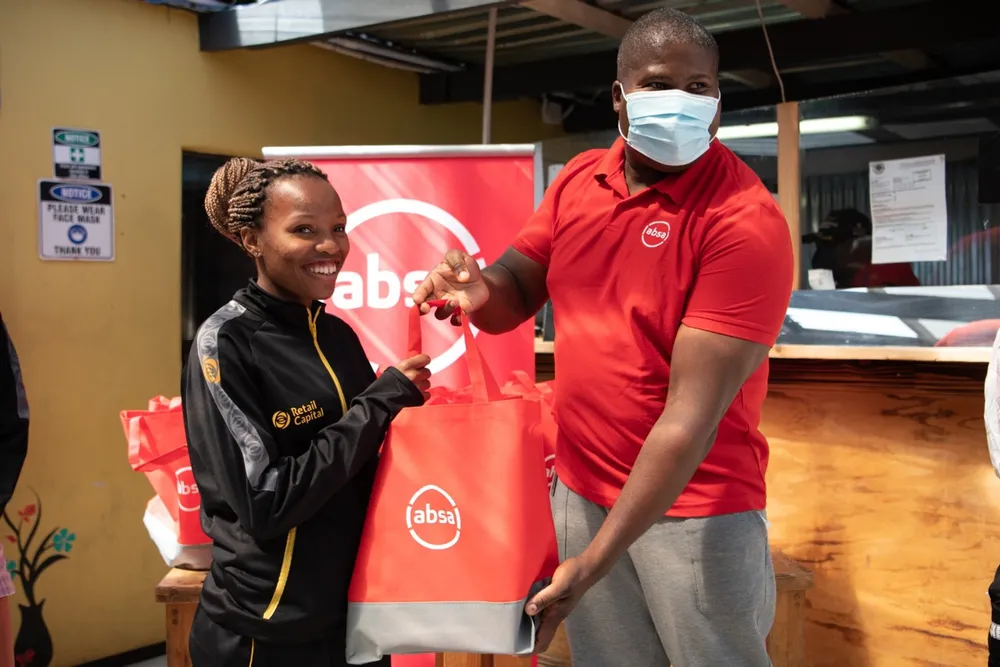 Absa hands over much needed shoes to Langa Running Club elite runners