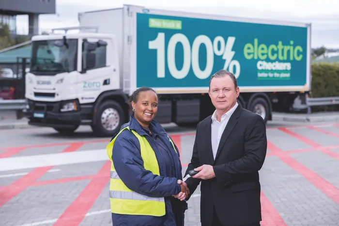 Truck driver Robin Jooste receives the keys to the Shoprite Group’s first electric truck from CEO Pieter Engelbrecht. Picture: Supplied