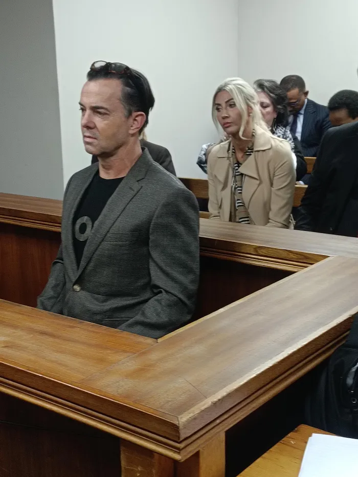 Peet Viljoen in the dock on Thursday, with his wife Mel Viljoen sitting behind him. 