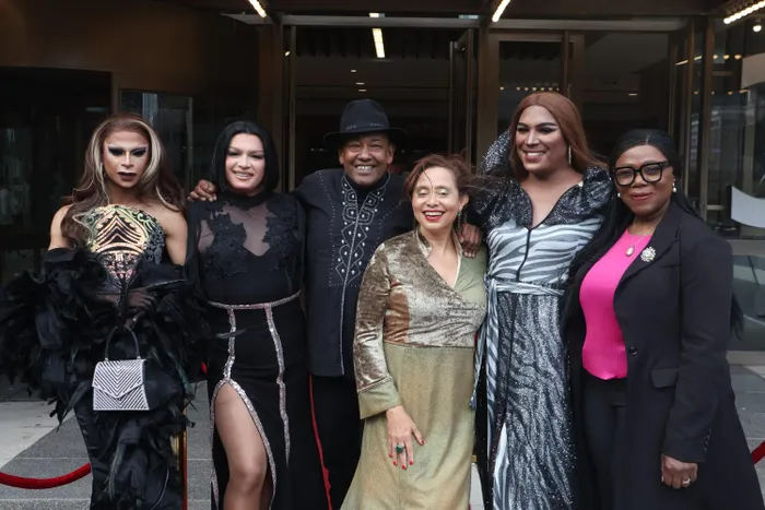 Artscape Theatre chief executive Marlene Le Roux (in green dress), Thuli Madonsela (wearing pink top) and actor Basil Appollis (with black hat) pose with drag artists at the theatre’s 55th anniversary this week. 