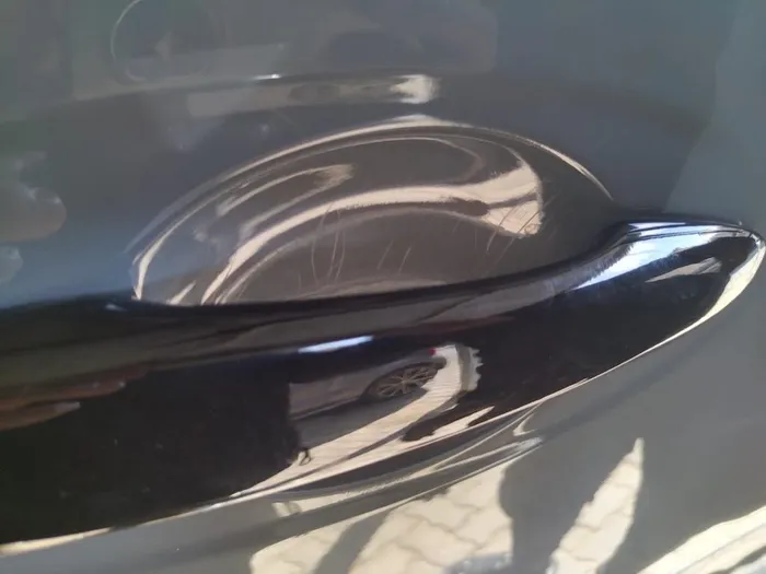 He claimed that the rear door under handle had severe scratches.