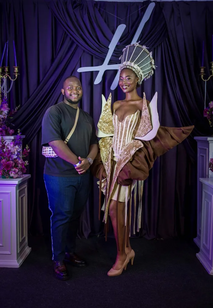 DUT fashion student Mlungisi Ndlovu (left) poses with model Sinegugu Mabizela 