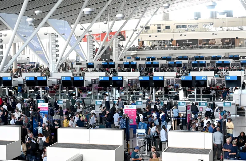 Manual processing for baggage, international arrivals at Cape Town International Airport after fire