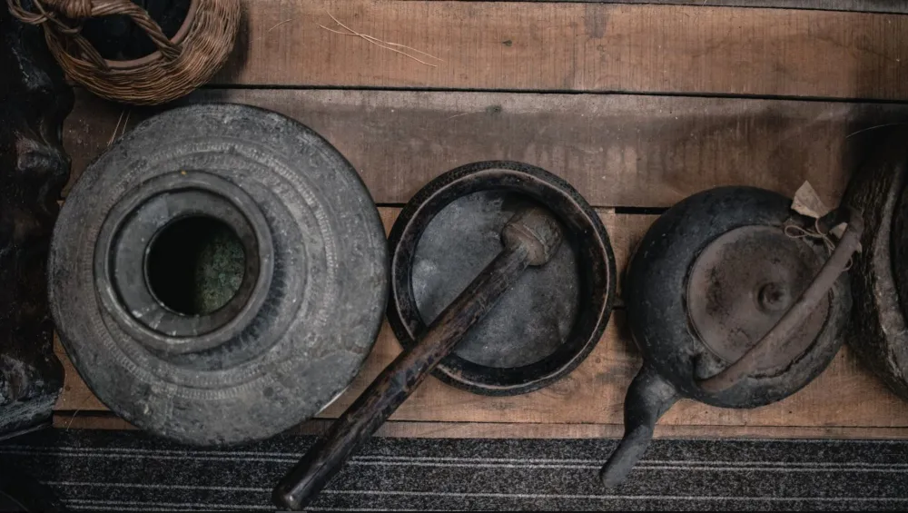 Basic kitchen utensils rest on a table.