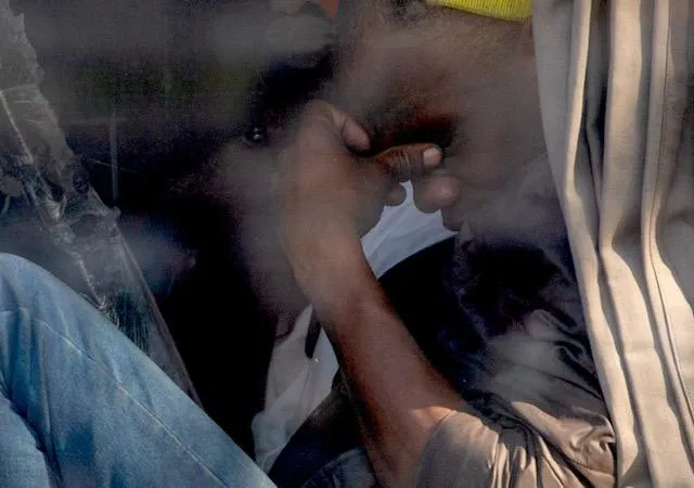 Repatriated foreign nationals sit inside buses at Durban’s Old Drive-In site as authorities coordinate transport operations in batches under tight security monitoring. 