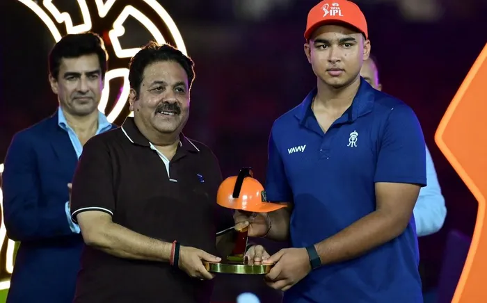Rajasthan Royals' Indian cricket player Vaibhav Sooryavanshi, right, is awarded the "Orange Cap" by Board of Control for Cricket in India (BCCI) vice president Rajeev Shukla during the presentation ceremony at the end of the 2026 Indian Premier League (IPL) T20 final match between Gujarat Titans and Royal Challengers Bengaluru in the Narendra Modi Stadium of Ahmedabad. 