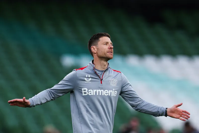 Bayer Leverkusen's Spanish head coach Xabi Alonso reacts as he leads a training session at the Dublin Arena stadium, in Dublin