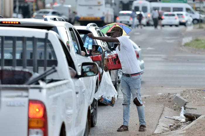 A hawker selling to motorists