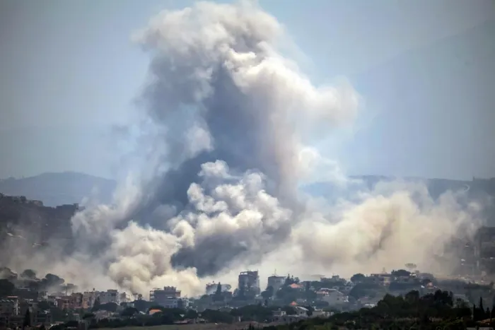 This image taken from the vicinity of the village Zawtar al-Sharqiyah in southern Lebanon, shows smoke rising from the site of an explosion carried out by the Israeli military, in the village of Kfar Tibnit .