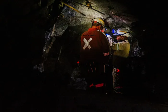 Miners stand inside a mine shaft in Mpumalanga, South Africa. Photographer: Waldo Swiegers/Bloomberg
