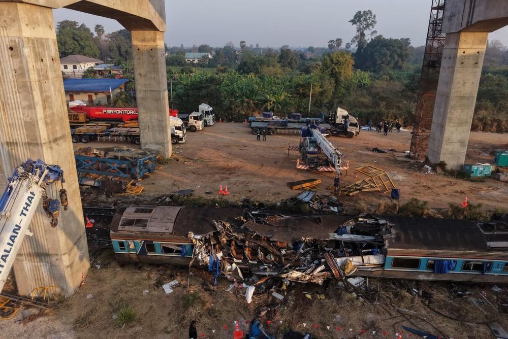 PICS: Crane collapses onto train in Thailand, killing 32