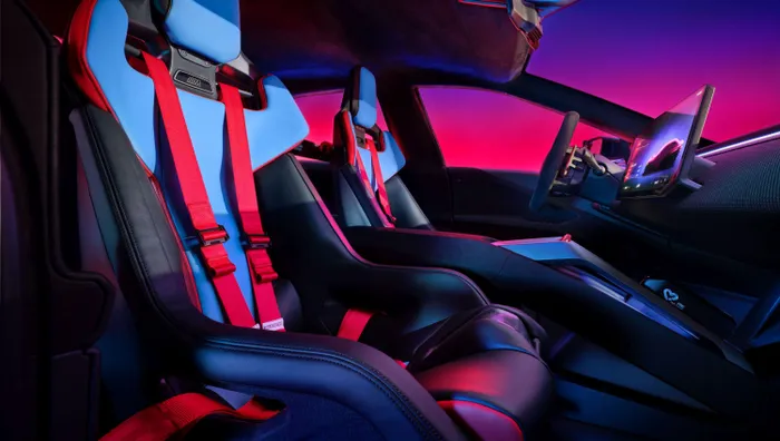 Four bucket seats and red harnesses make it clear that performance remains the priority.