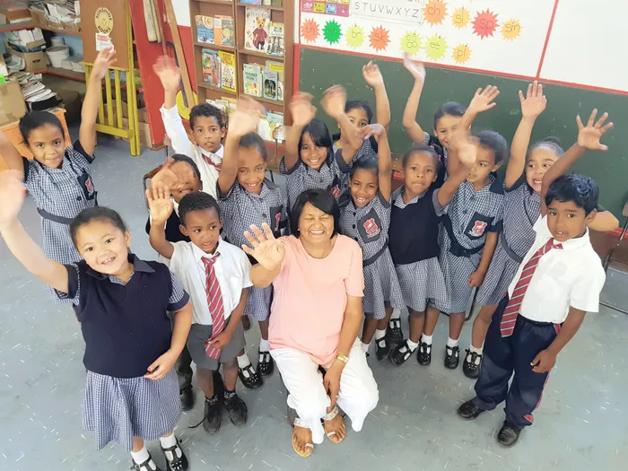 The children bid their teacher farewell.