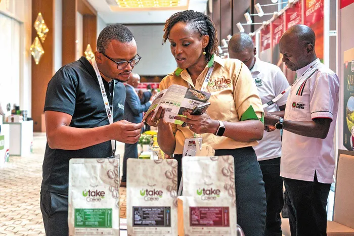 Visitors at the China-Kenya Business Forum learn about Kenyan coffee in Nairobi on March 23. The event focused on China’s decision to grant zero-tariff access from May 1 to African goods. 
