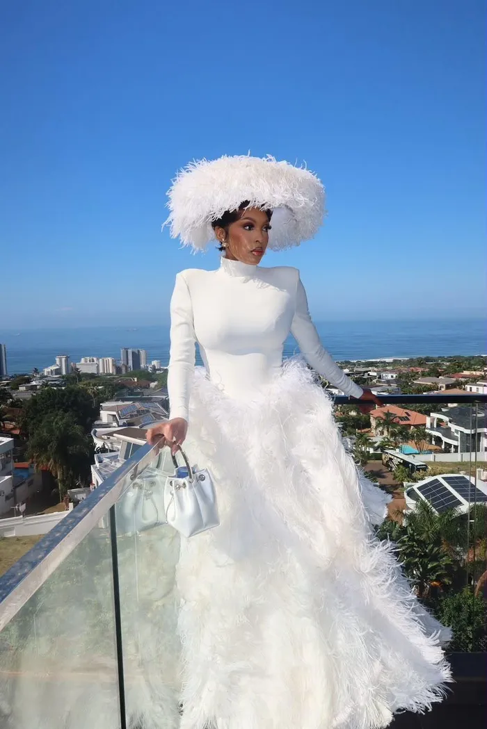 Linda Mtoba arrives at the 2026 Durban July in a custom couture gown by award-winning designer Orapeleng Modutle, crafted in partnership with Don Julio. 