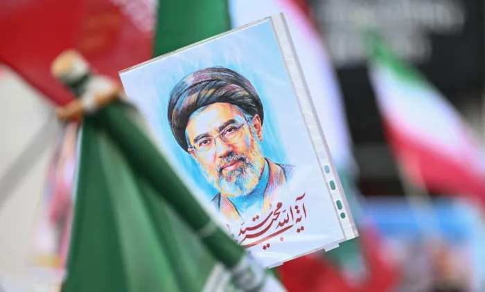 Iranian supreme leader Ayatollah Mojtaba Khamenei, seen here in a portrait, says that countries in the region will no longer serve as shields for US bases.