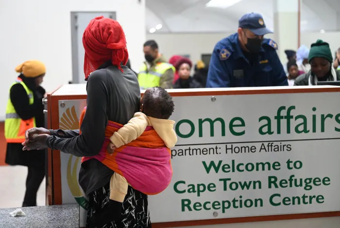 Zimbabwean Foreign Nationals form queues to be processed.