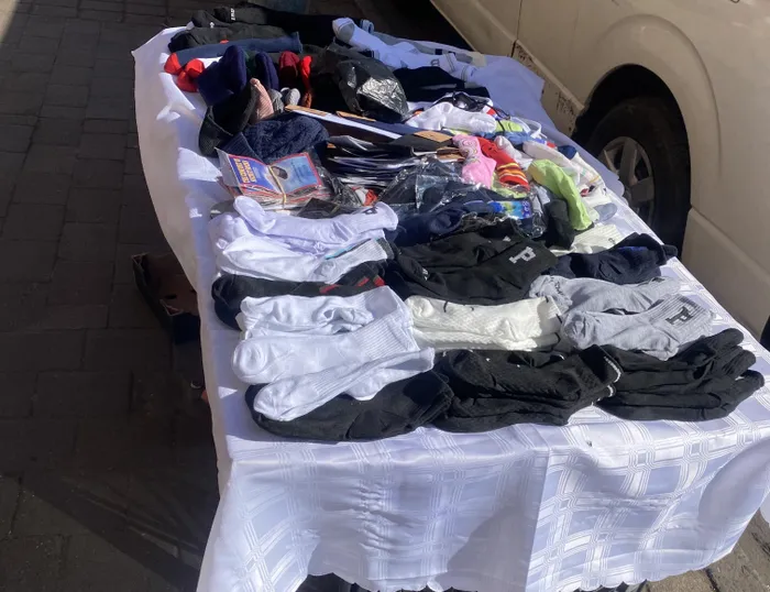Clothing items such as socks and hats on display at a street vendor stall in the Johannesburg CBD ahead of the June 30 protests.
