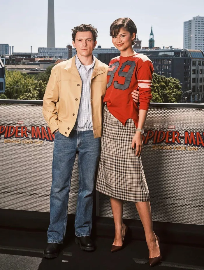 A casual top paired with a check skirt struck the perfect balance between relaxed and stylish. 

