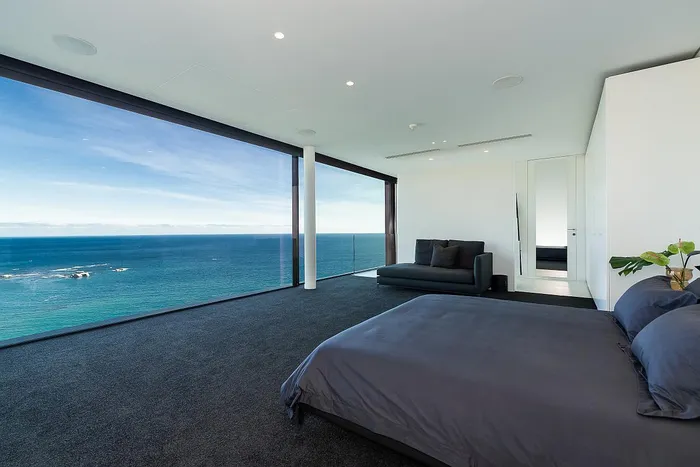 This expansive contemporary residence includes four bedrooms and four bathrooms.