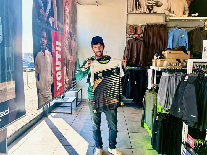 IOL Sport’s Michael Sherman found a budget-friendly alternative to the expensive Bafana FIFA World Cup jersey with the nostalgic 1996 Africa Cup of Nations replica, available for just R299 at Mr Price home. Picture: Farryn Sherman