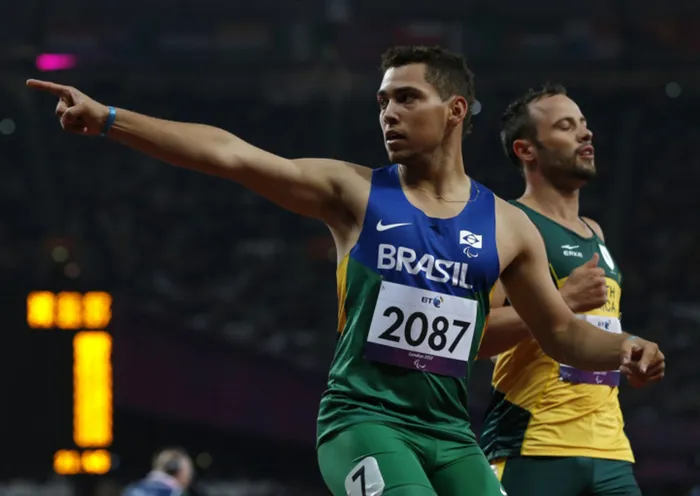 Brazil's Alan Oliveira (left) celebrates in front of South Africa's Oscar Pistorius after winning the men's 200m T44 classification at the Olympic Stadium during the London 2012 Paralympic Games on Sunday. This classification is for athletes with an impairment that affects their arms or legs, including amputees.