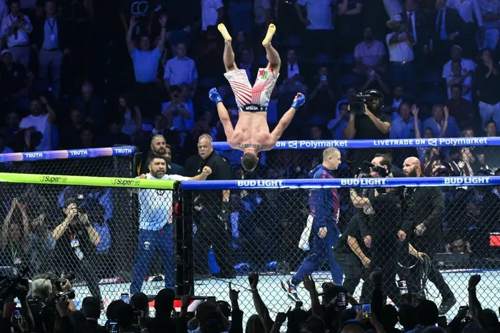America's Justin Gaethje celebrates after defeating Georgia's Ilia Topuria during "UFC Freedom 250" mixed martial arts event on the South Lawn of the White House in Washington, DC, in the early morning hours of June 15, 2026. 
